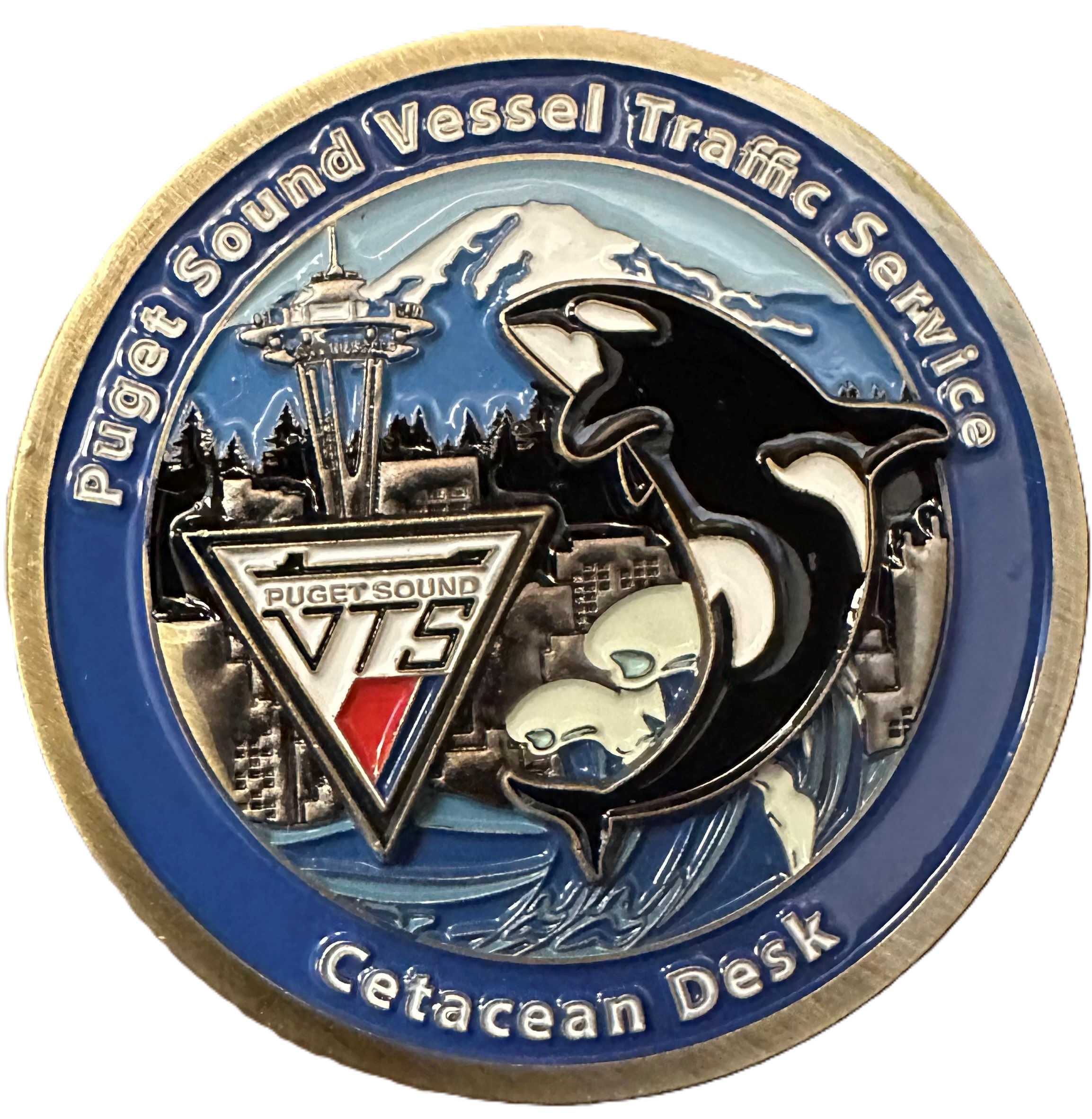 VTS Cetacean desk logo- orca with space needle and VTS logo